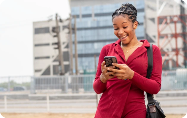 Invincible Pay Direct Deposit, Person looking at phone with payment confirmation/